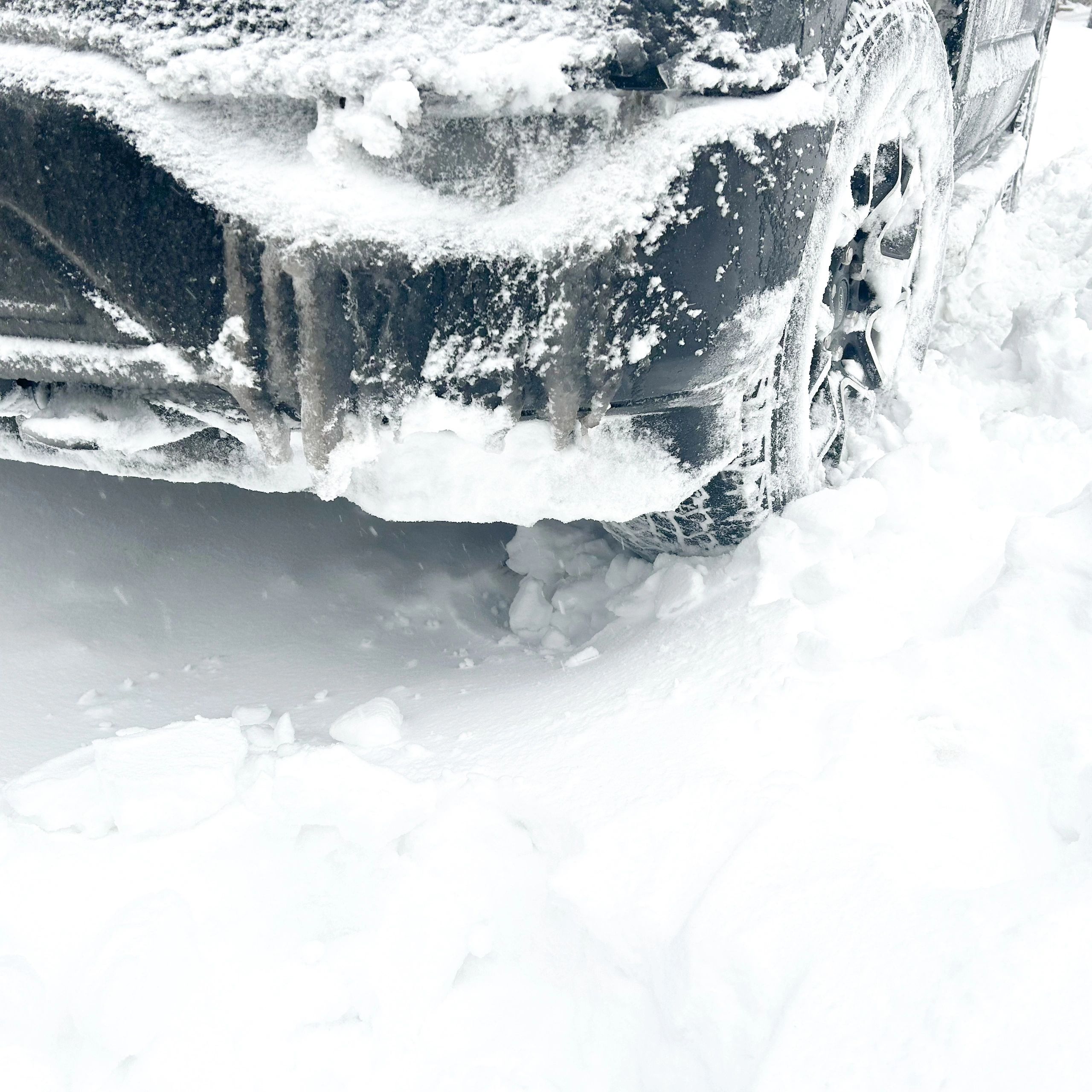 Close-up of a truck tire in snowy conditions