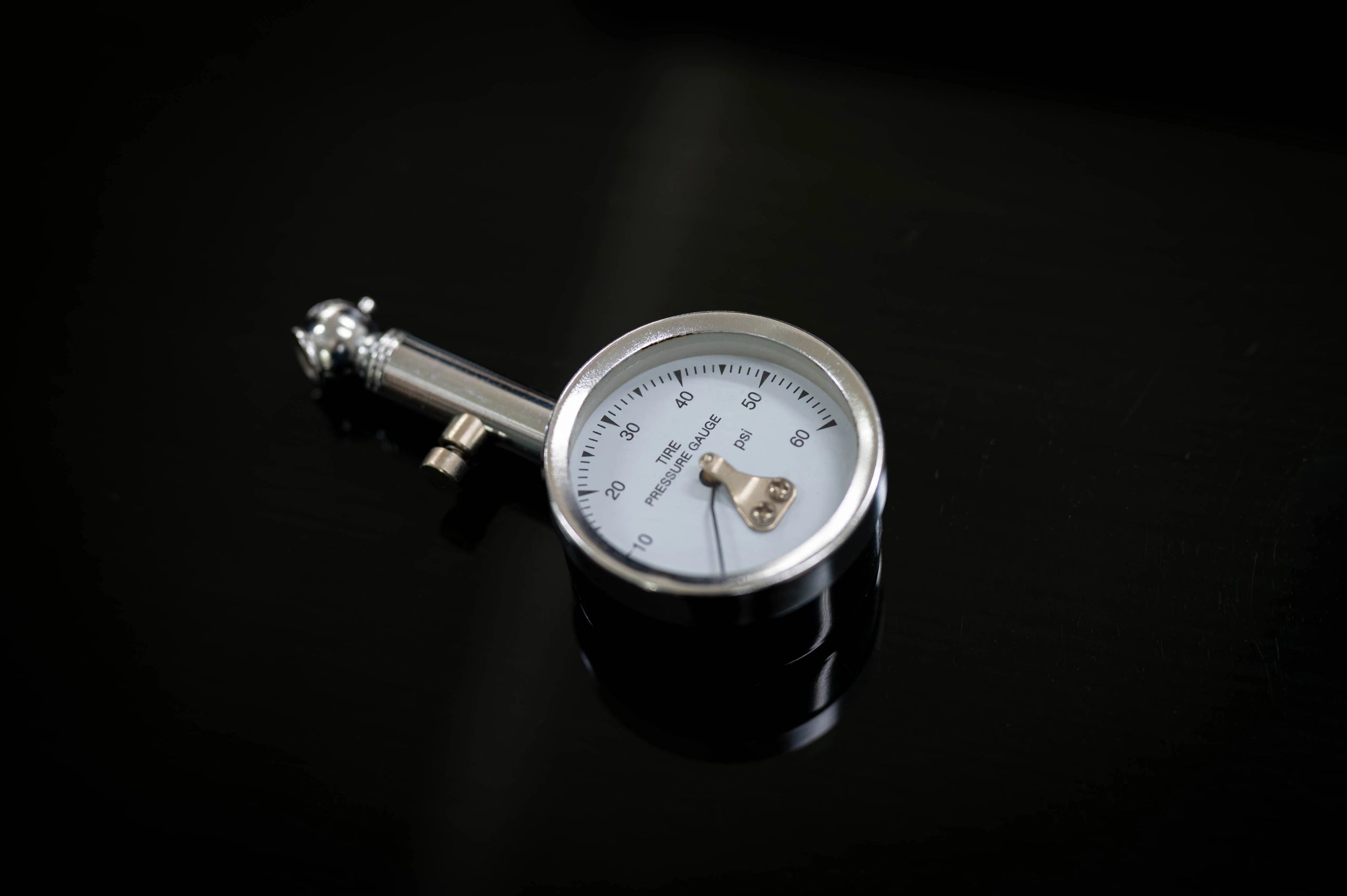 Analog tire pressure gauge close-up